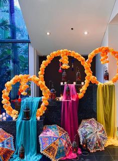 an assortment of umbrellas and decorations on display