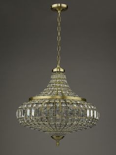 a chandelier hanging from the ceiling in an old fashioned style with crystal beads