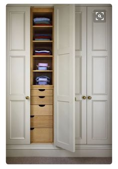 an open closet with drawers and clothes in it