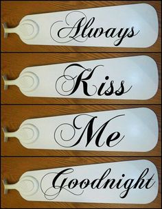 three white spoons with black lettering on them that say, always kiss me goodnight