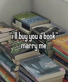 a pile of books with the words i'll buy you a book marry me