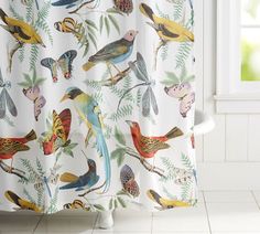 a shower curtain with colorful birds on it