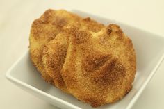 some fried food in a white bowl on a table