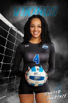 a woman holding a volleyball ball in front of a net with the number 4 on it