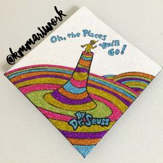 a card with an image of a colorful hat on the front and words that say oh, the places you'll go