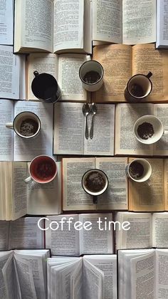 coffee cups and spoons are arranged on top of an open book with the words coffee time above them