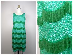 "This is an EXQUISITE vintage couture dress by Alexander's Boutique! It's HEAVILY embellished with fringed glass beading and green sequins. It's in EXCELLENT condition! Bust - 36\" Waist - 30\" Hips - 38\" Length - 37\" This dress comes from a pet-free and smoke-free home. If you would like more info or have any questions, please don't hesitate to ask!" Emerald Sequin Dress, Emerald Green Sequin Dress, Heavy Fringe, Green Sequin Dress, Iridescent Dress, Green Stuff, Vintage Couture, Beaded Gown, Green Sequins