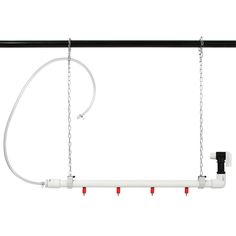 an overhead light fixture with three red and white lights hanging from it's sides