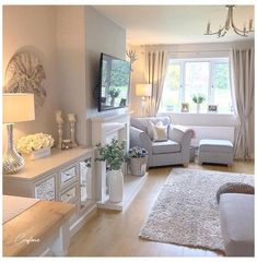 a living room filled with furniture and a flat screen tv