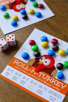 two game cards and dices on a table with the words roll - a - turkey