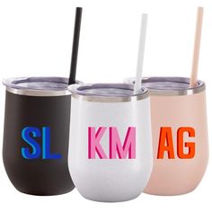 three different colored tumblers with straws in them and the words sl km ag