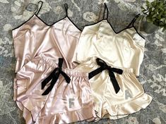 Celebrate your bridal shower with a touch of sparkle and sophistication in our personalized satin pajama set. Each set features a beautifully crafted sparkly monogram, adding a unique and elegant touch to your pre-wedding festivities. The luxurious satin fabric and stylish design of the tank and shorts make these pajamas perfect for a comfortable yet chic look as you prepare for the big day. This set is not only a delightful gift for your bridesmaids but also a cherished keepsake that they will treasure long after the celebrations. Make your bridal party feel extra special with these custom pajamas, designed to bring joy and sparkle to your get-ready moments. Available in a variety of sizes, this set ensures a perfect fit for everyone. Order now and let your bridal party shine in style! Pa Custom Pajamas, Pajama Gift Set, Pajama Gift, Monogrammed Pajamas, Satin Pajama Set, Wedding Festivities, Bridesmaid Getting Ready, Satin Pajama, Pajamas Gift