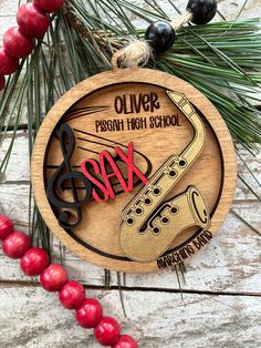 Commemorate a marching band season with a custom Personalized Marching Band Christmas Tree Ornament. Perfect gift for a saxophone marching band student or band director.  2 layer laser cut and engraved with your  name and/or school.  You will also choose the color we paint "sax" to match the school color. Approx 3 3/4" wide. Please message us for prices for 20 or more ornaments Piccolo Instrument, Marching Band Gift, Brass Music, Flute Instrument, Band Christmas, Senior Night Gifts, Band Director, Senior Gifts, Music Instrument