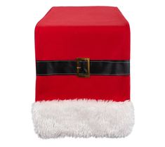 a red and white santa claus hat on top of a box with black trimmings