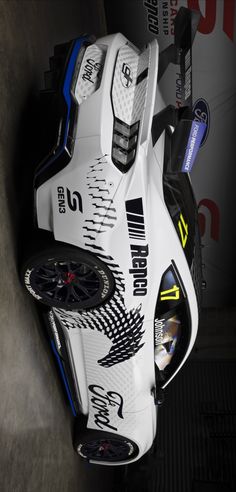 a white motorcycle parked inside of a garage