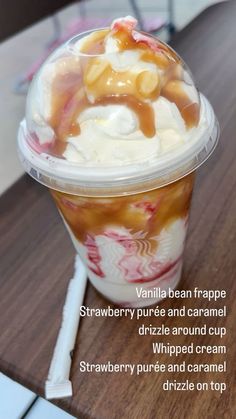 an ice cream sundae with caramel syrup and whipped cream in a plastic cup