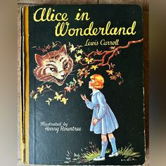 an old children's book with the title alice in wonderland written by lewis carroll