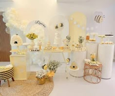 the dessert table is decorated with honeybees and flowers