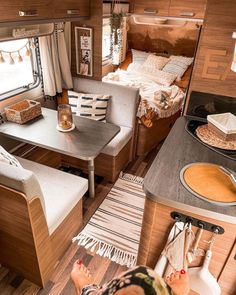 the interior of a camper with a kitchen and living area in it, as seen from above