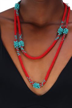 Brightly colored red and turquoise necklace inspired by an exotic flower made out of woven Japanese glass beads and 925 sterling silver clasp. Single strand can be worn long or double. Handmade Red Beaded Lariat Necklace, Red Hand-strung Beaded Necklaces, Red Hand-strung Beaded Necklace, Red Artisan Handwoven Jewelry, Red Handwoven Beads For Jewelry Making, Unique Handwoven Red Jewelry, Unique Red Handwoven Necklace, Unique Red Multi-strand Beaded Necklaces, Red Long Beaded Necklace Hand-strung