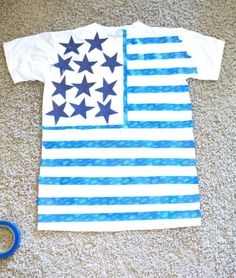 a t - shirt that has been made to look like an american flag and scissors