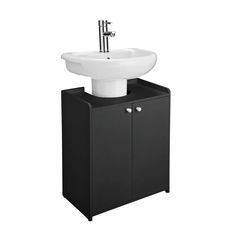 a white sink sitting next to a black cabinet