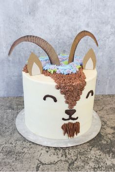 a cake decorated to look like a goat with horns