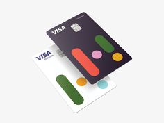 two credit cards with different colors and shapes on the front one has a visa card attached to it