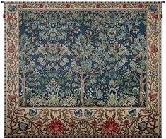 an intricately designed rug with trees and flowers in blue, green, red and beige colors