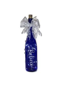 a blue glass bottle with a bow on the top that says love in white lettering