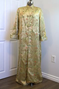 An absolute stunning, show-stopper of a robe. Beautiful shimmering pale gold silk satin, embroidered with scenes of flowers, trees, birds, and a man plying a boat down a river. Made in Hangzhou China by a maker that appears to read "Felz or Folz [not sure of this word] Squirrel". Fully lined in a paler, creamy shade of silk. Decadent luxury for when you want to feel like a glamourous old Hollywood actress! Robe features: -mandarin collar -full floor-length -five front frog closures -two pockets Long Silk Robe For Daywear, Chinese Dressing, Old Hollywood Actresses, Hangzhou China, Cat Allergies, House Coat, Dressing Gown Robe, Hollywood Actress, Gold Silk