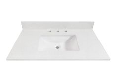 a white bathroom sink sitting on top of a counter next to a faucet