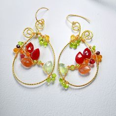 Indulge in the boho chic charm with these large teardrop multi gemstones earrings, featuring carnelian, sunstone, prehnite, citrine, garnet and peridot.  These handmade, colorful flower woven hoops make a unique gift for her. Perfect for any jewelry lover, these luxury gem wire-weaved earrings are a statement piece that blends whimsy with elegance. ▶️ Natural multi gemstone weaved earrings length - approx. 2.5 x 1.25 inch / 6,5x 3,2 cm ▶️ MATERIAL: ◾️ 18K gold plated textured wire and finish, ox Bohemian Gold Carnelian Earrings, Gold Bohemian Carnelian Earrings, Unique Dangle Earrings With Gemstone Beads, Bohemian Teardrop Wire Wrapped Jewelry, Bohemian Wire Wrapped Teardrop Jewelry, Handmade Bohemian Teardrop Jewelry, Bohemian Handmade Teardrop Jewelry, Bohemian Teardrop Jewelry With Ear Wire, Orange Bohemian Jewelry With Gemstone Beads