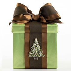 a green gift box with a christmas tree on it