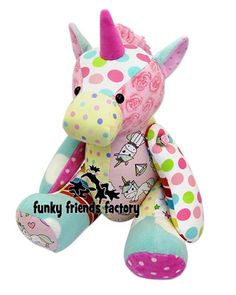 a pink and blue stuffed animal with polka dots