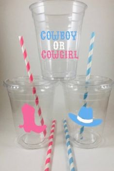 three cups with straws in them sitting next to each other