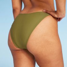 Extra-cheeky bikini bottom from Wild Fable™ in a solid hue. Made from soft fabric with spandex and full lining for stretchy comfort in and out of the water. Opaque construction with low rise and ultra-high leg. If you're not satisfied with any Target Owned Brand item, return it within one year with a receipt for an exchange or a refund. Wild Fable™: A look for every story. Solid Seamless Bottoms For Poolside, Stretch Solid Color Swim Trunks For Beach, Summer Stretch Swimwear With Smooth Texture, Stretch Solid Swimwear For Beach Season, Solid Swimwear With Smooth Texture For Beach, Solid Color Stretch Tankini With Briefs, Solid Stretch Tankini Brief, Solid Color Stretch Tankini Brief, Solid Brief Swimwear For Vacation