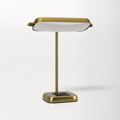 a gold desk lamp with a white light on the top and one arm folded open