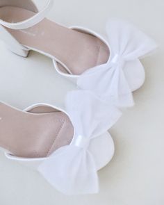 This flower girls block heels adorn with a charming tulle bow detail adds a touch of an elegance and grace for little princess for birthday party, holiday party, wedding party, flower girls, quinceanera shoes, and other special occasions.DETAILS:HEEL HEIGHT: 2 inchesCOLORS AVAILABLE: White and IvoryUPPER: Synthetic upper and liningMATERIALS: Manmade outsole Quinceanera Shoes, Tulle Bow, Tulle Bows, Girls Heels, Flower Girls, White Satin, Bow Detail, Little Princess, Party Wedding