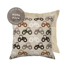 a pillow with a tractor pattern on it and a tag for the pillow that says minky pillow