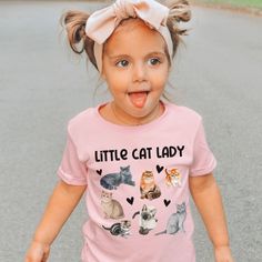 This adorable Little Cat Lady shirt for toddler and girls will be their new favorite tee!  With watercolor print Kittens and Cats and adorable hearts it will get their future cat lady vibes going!  Check our shop for a baby version of this design! * Q U I C K * F A C T S * ✺ 100% preshrunk cotton ✺ Heather colors are 52% combed and ring-spun cotton, 48% polyester ✺ Athletic Heather is 90% combed and ring-spun cotton, 10% polyester ✺ Inside out and wash and dry normally (on cool for best results). Do not iron decoration. ✺ printed using DTG Direct to Garment printing.  ✺ Colors may vary due to computer monitors and printing inks. ✺ While we offer several shirt colors some may have a better contrast with the design. Keep that in mind when choosing your color.  * S I Z I N G * ✺ Sizing is uni Cute Pink T-shirt With Cat Print, Cute Pink Cat Print T-shirt, Lady Cat, Lover Girl, Girl Cat, Kitten Lover, Little Cat, Shirt Girl, Girls Graphic Tee