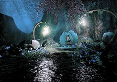 an animated scene with flowers and lights in the dark forest, surrounded by bluebells