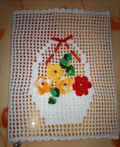 a crocheted doily with flowers on it