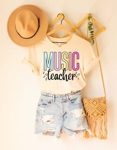 ABOUT OUR Music Teacher Shirt: PRODUCTION TIME: 1-3 days (Usually 2 days) SHIPPING TIME: 2-5 days (Usually 3 days) PRODUCT DESCRIPTION: Bella Canvas Unisex T-shirt Super soft cotton and excellent quality print makes. 100% Soft cotton (fibre content may vary for different colors) Light fabric (4.2 oz/yd² (142 g/m Runs true to size Our Relaxed Fit Tee (Bella + Canvas style 3001) is a unisex style that runs a touch small for men, and about a half a size large for women. It's a relaxed fit and is so School Tops In Cotton With Band Merch Style, Cotton Band Merch Tops For School, School Cotton Tops With Band Merch Style, Band Merch Cotton Tops For School, Festival Cotton T-shirt With Letter Print, Spring Cotton Tops With Music-themed Style, Spring Music-themed Cotton Tops, Music Teacher Outfits, Music-themed Cotton Tops With Slogan