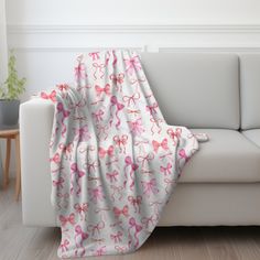 a white couch with pink bows on it