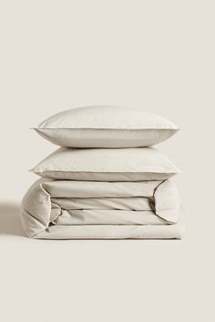 three pillows stacked on top of each other