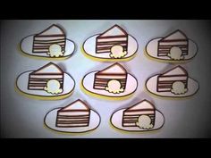 six decorated cookies in the shape of houses