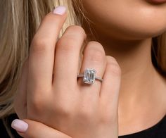 a close up of a person wearing a ring