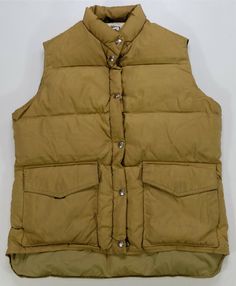 Rare Vintage WOOLRICH Full Zip Snap Button Down Puffer Vest Jacket 80s Brown measurements are included in the photographs flaws -tiny nicks in material, light discoloring spots and blemishes on front and back -faded size tag Thanks for checking out DasCardHaus! We provide you great deals on vintage clothing items such as shirts, jackets and hats. All items are shipped out via USPS and we use eBay’s global shipping program for international orders. If you have any questions, comments or concerns Vintage Solid Color Button-up Outerwear, Retro Khaki Outerwear With Button Closure, Vintage Outdoor Outerwear With Snap Buttons, Retro Winter Outerwear With Button Closure, Vintage Outerwear With Snap Buttons For Outdoor, Vintage Solid Color Winter Outerwear, Vintage Outerwear For Winter, Vintage Puffer Jacket, Puffer Vest Jacket