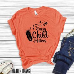 Show your support and raise awareness with our Every Child Matters Orange Shirt collection, designed to honor the lives of Indigenous children, featuring the Every Child Matters slogan with various indigenous graphics and designs. These shirts give a powerful message of unity and support for indigenous communities. Perfect for casual wear or as a statement piece during Indigenous Peoples' Day celebrations. Product features - Unisex fit for versatile styling - Made with lightweight and breathable 100% cotton - Classic crew neckline for easy accessorizing - Manufactured in a humane and sustainable way by Bella+Canvas - Variety of fabric blends for different color options Care instructions - Machine wash: cold (max 30C or 90F) - Non-chlorine: bleach as needed - Tumble dry: low heat - Iron, st Cotton Graphic Print Shirt For Awareness Events, Casual Pre-shrunk T-shirt For Awareness Events, Cotton Shirt With Graphic Print For Awareness Events, Pre-shrunk Short Sleeve T-shirt For Awareness Events, Cotton Tops With Letter Print For Awareness Events, Casual Cotton Shirt For Awareness Events, Indigenous Peoples Day, Every Child Matters, Orange Shirt